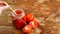 Glass of tomato juice on wooden table. Fresh tomato juice and chopped tomatoes