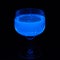 Glass of tonic glowing in UV