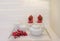 Glass tray with white teapot, cups and red grapes