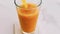 Glass of tropical orange juice with chia seeds on marble table, drink and beverage