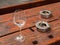 A glass and two ashtrays outside a pub