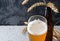 Glass of unfiltered craft wheat beer on a dark background