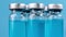 Glass vials of with blue coloured liquid