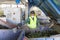 Glass waste worker in recycling facility