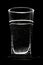 Glass of water on the black background. outlines of the faces of the glass. Black background.