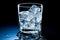 Glass with water and ice cubes on a black background. A refreshing and chilling drink. Generative AI