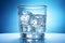 Glass with water and ice cubes on a blue background. A refreshing and chilling drink. Generative AI