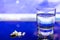 Glass of Water with IceClose-up view of pills and glass of water