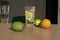 Glass of water with lemon and lime on a wooden table in the room Ai Generativ