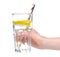 Glass of water with lemon tube in hand