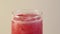 Glass of Watermelon smoothie, close-up. Rotation motion. Healthy refreshing summer drink.