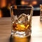 A glass of whiskey close-up. Product photography. Glass of old whiskey standing on a table in a luxury bar. Composition of whiskey