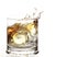 A Glass of whisky with ice cube splash