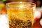 Glass of Whisky whiskey, bourbon, ice tea or coke cola soda with ice and water drops on wood table at blur background