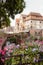 Glass of white wine at the festival of young wine of the old French city and flowers, selective focus