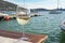 Glass of white wine at the marina bar