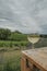 Glass of white wine on the terrace close-up across vineyards, castle. and blue sky. winemaking