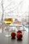 Glass of white wine Three tangerines on winter background