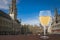 Glass of white wine with view of Grand Place Grote Markt in Brussels, Belgium