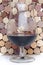 Glass of wine on a background of corks