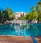 A glass of wine on the background of the pool in Siurana, Tarragona, Spain. With selective focus