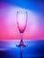 Glass of wine on colorful background