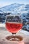 Glass of wine and winter alps landscape