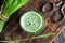 A glass of young barley grass juice, top view