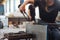 A glassblower student tries to make a flower out of glass