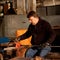 Glassblowing artisan at work in a crystal glass workshop