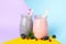 Glasses berry milkshake on two tone background. Summer drink