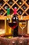 Glasses and bottles of red and white wine on old barrel in wine cellar