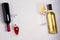 Glasses and bottles of red and white wine on white background. Wine still life. top view; horizontal