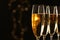 Glasses of champagne on blurred background. Space for text