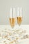 Glasses of champagne with decor on white table