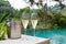 Glasses of champagne near pool