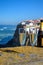 Glasses of champagne sparkling wine and view on white houses of picturesque village Azenhas do mar, Lisbon area, Portugal