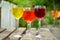 Glasses with colorful wine