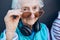 Glasses, cool and fashion portrait of old woman with music headphones, luxury senior style or creative accessory. Vision