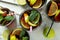 Glasses of Cuba Libre on white textured table, top view