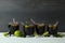 Glasses of Cuba Libre on wooden table against dark background