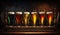 Glasses with different sorts of craft beer on wooden bar. Tap beer in pint glasses arranged in a row