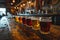 Glasses with different types of craft beer on a wooden stand