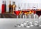 Glasses with different wines on table against blurred background.