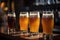 glasses of draught beer in a row, with foaming and carbonation visible