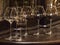 Glasses of elite wine on the bar in dark interior