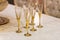 Glasses or flutes on golden stem on table