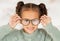 Glasses, frame and portrait of child with vision, eye care and eyes healthcare, wellness and insurance trust, choice and