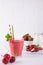 Glasses of fresh cold smoothie with fruit and berries, on white table background. Healthy food for breakfast, snack