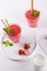 Glasses of fresh cold smoothie with fruit and berries, on white table background. Healthy food for breakfast, snack